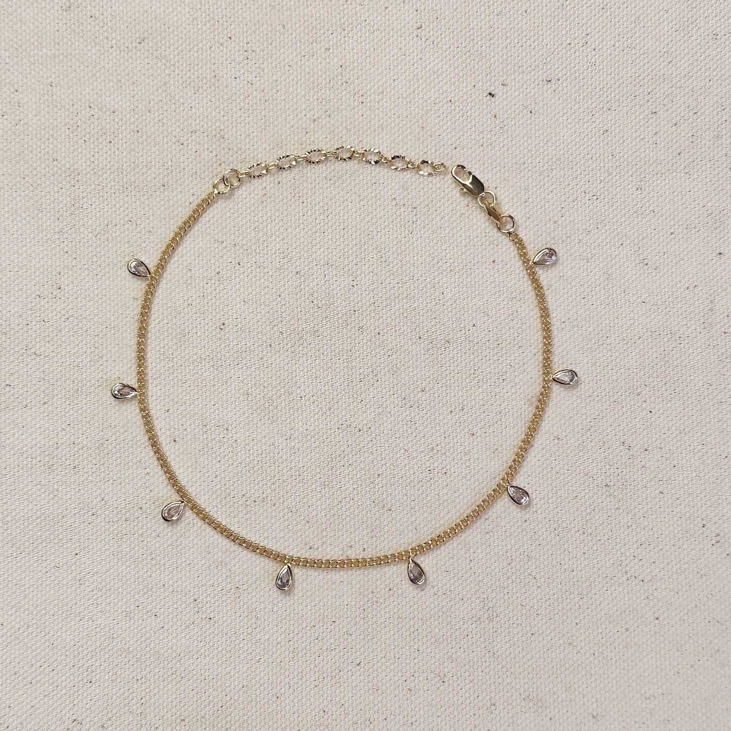 Chaîne gourmette de 2 mm remplie d'or 18 carats avec lunette CZ Drops