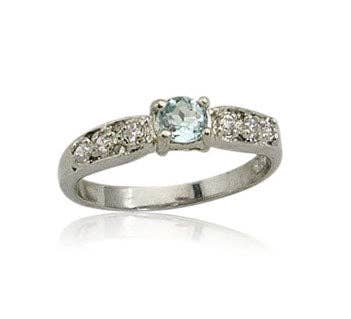 Petite bague en platine/argent sterling avec topaze bleue