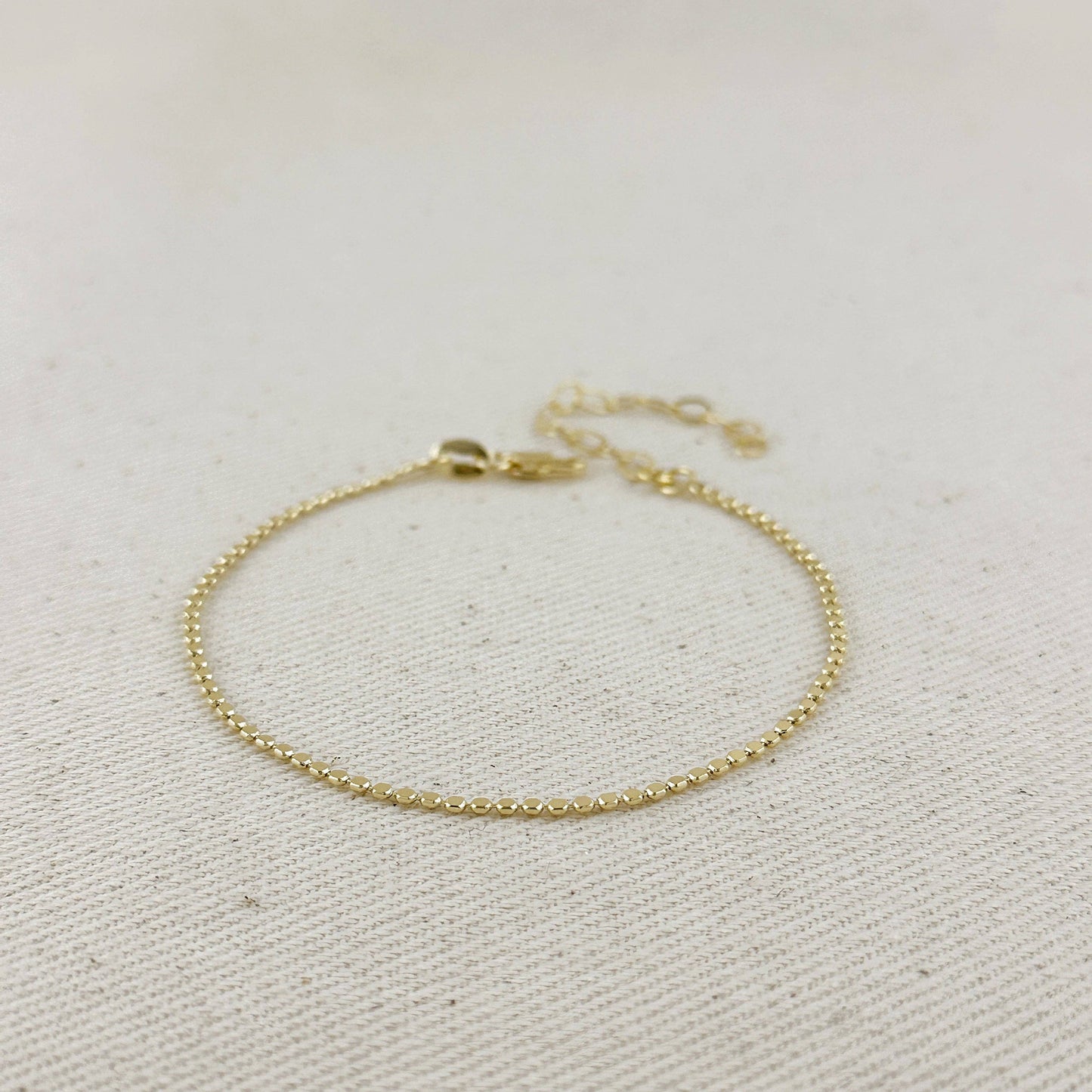Bracelet à billes plates 1,5 mm en or rempli 18k