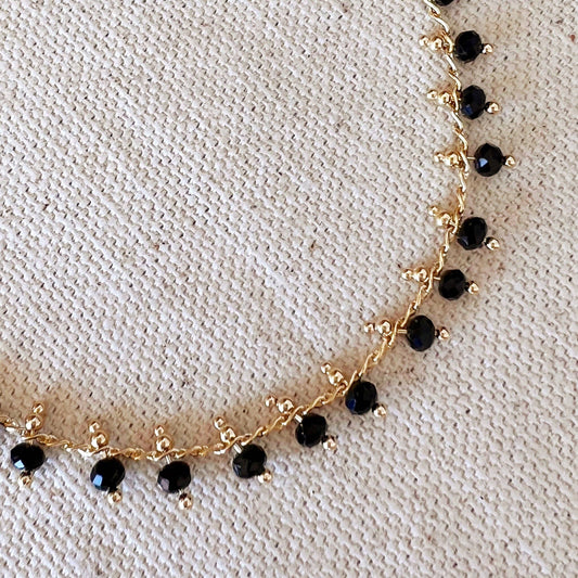 Bracelet en perles noires remplies d'or 18 carats