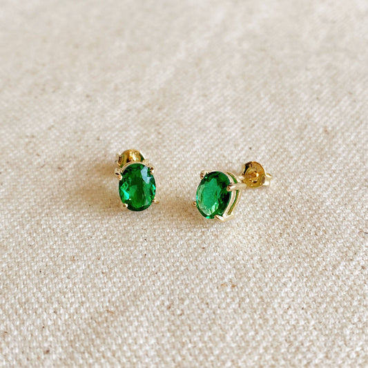 Boucles d'oreilles à tige en or 18 carats avec émeraude ovale et zircone cubique