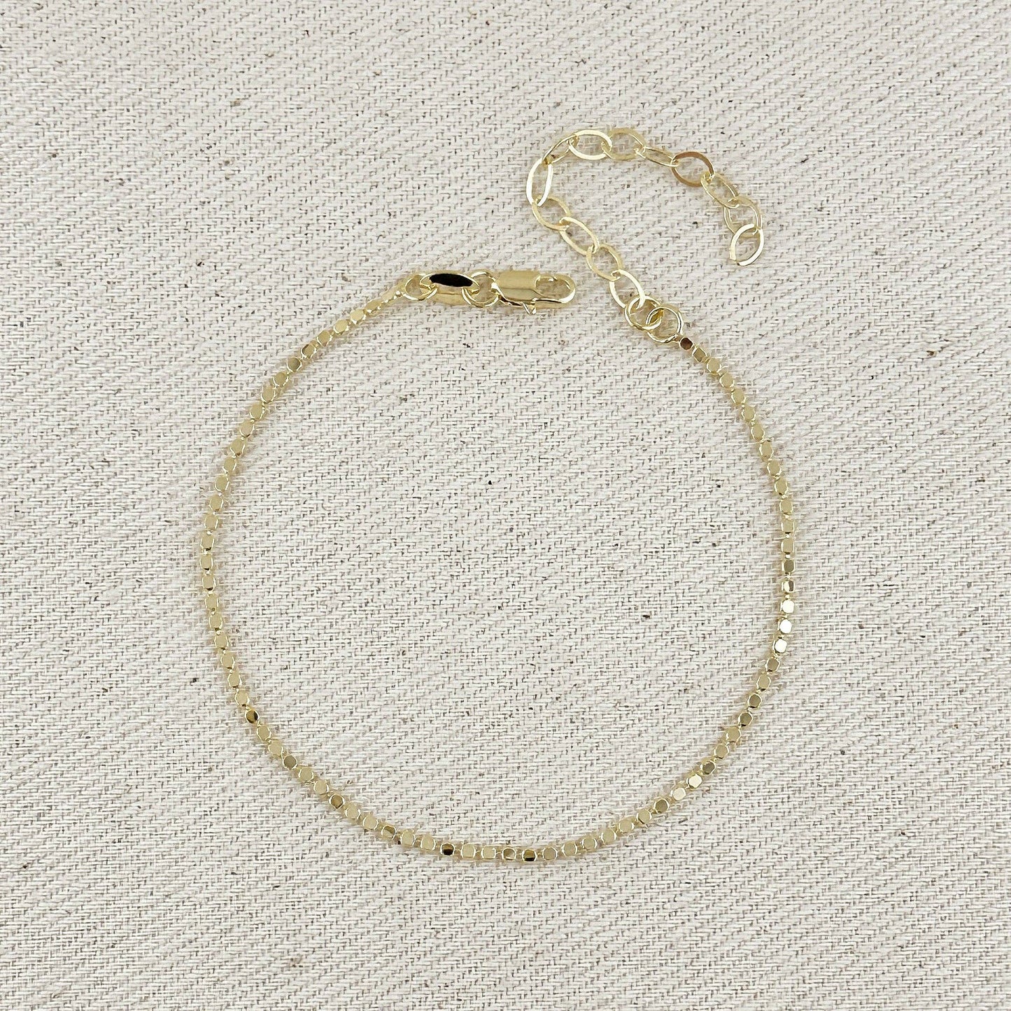 Bracelet à billes plates 1,5 mm en or rempli 18k